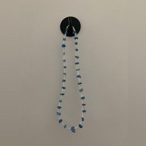 White and blue beaded necklace with twist clasp